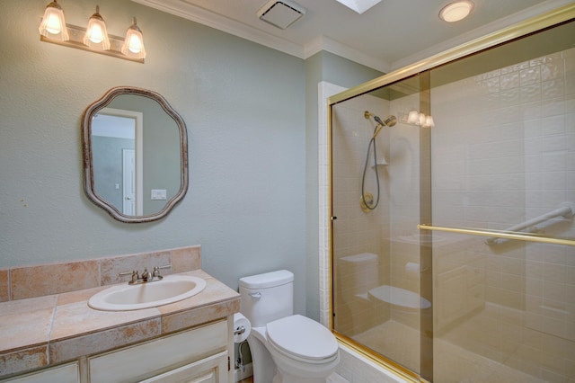 bathroom with visible vents, crown molding, toilet, a stall shower, and vanity