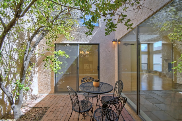 wooden terrace featuring a patio