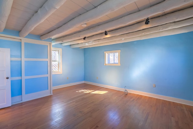 506 Onate Pl, Santa Fe, NM 87501 - empty room with beam ceiling, wood ceiling, and wood finished floors