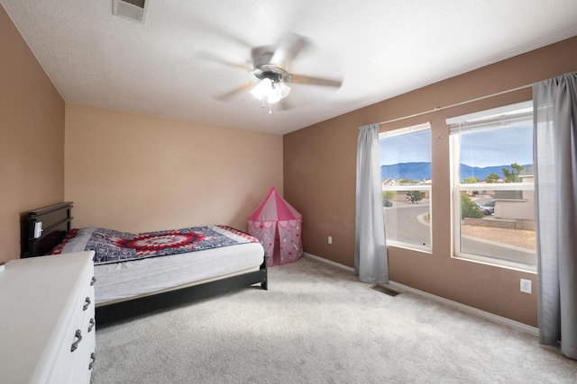 101 Colinas Ave NE, Albuquerque, NM 87113 - carpeted bedroom with a ceiling fan, baseboards, visible vents, and a textured ceiling