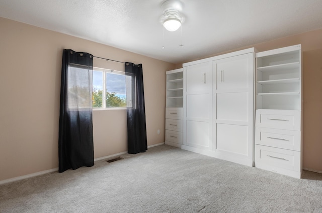 101 Colinas Ave NE, Albuquerque, NM 87113 - unfurnished bedroom with visible vents, baseboards, light colored carpet, and a closet