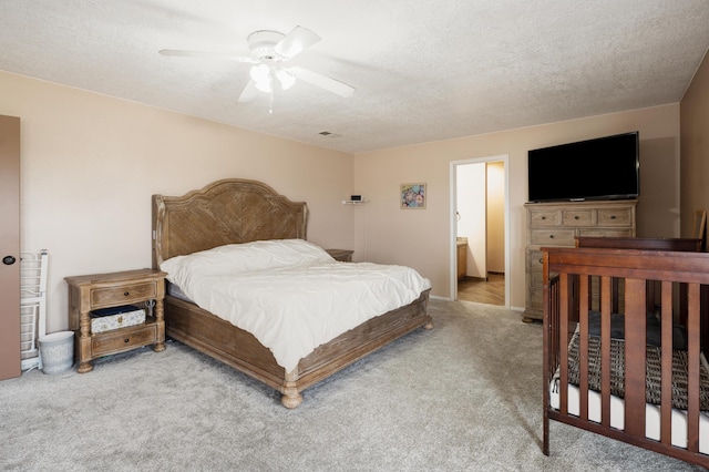 101 Colinas Ave NE, Albuquerque, NM 87113 - bedroom featuring carpet, ceiling fan, and a textured ceiling