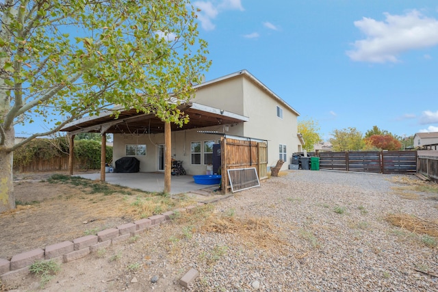 101 Colinas Ave NE, Albuquerque, NM 87113 - back of property featuring a patio, a fenced backyard, and stucco siding