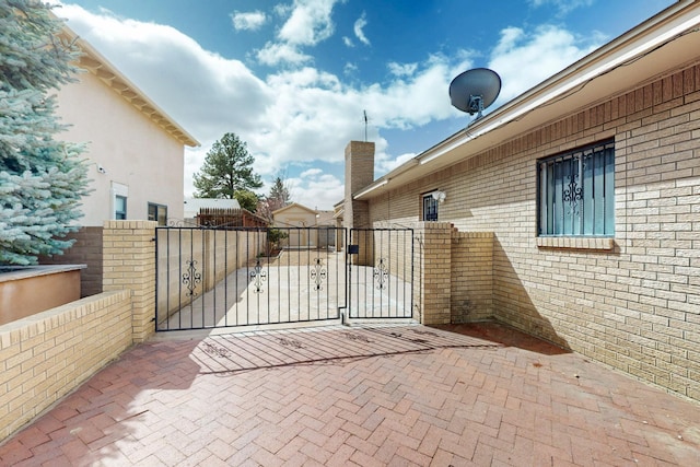 view of gate with fence