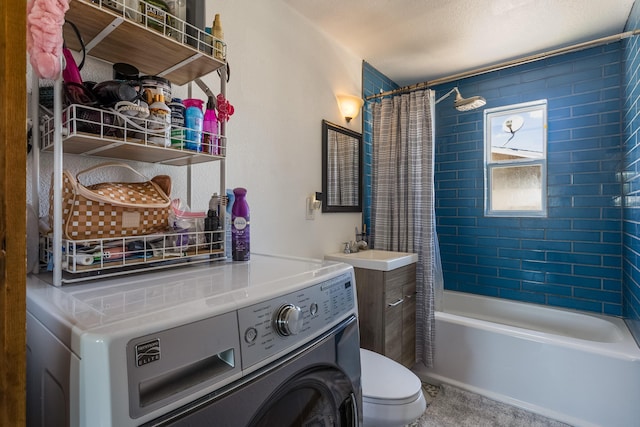 full bathroom with washer / clothes dryer, toilet, shower / tub combo, and vanity