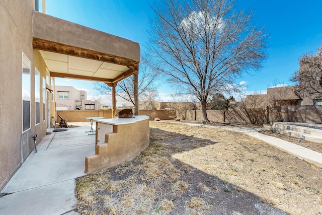 1001 Calle Garza NE, Albuquerque, NM 87113 - view of yard with a patio and a fenced backyard