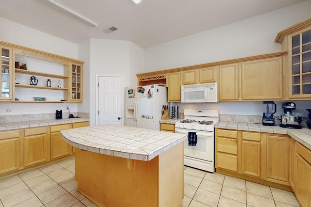 1001 Calle Garza NE, Albuquerque, NM 87113 - kitchen with light tile patterned floors, visible vents, white appliances, and a center island