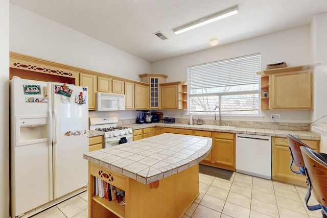 1001 Calle Garza NE, Albuquerque, NM 87113 - kitchen with white appliances, visible vents, open shelves, a sink, and a center island
