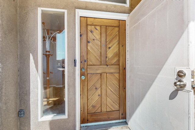1001 Calle Garza NE, Albuquerque, NM 87113 - doorway to property featuring stucco siding