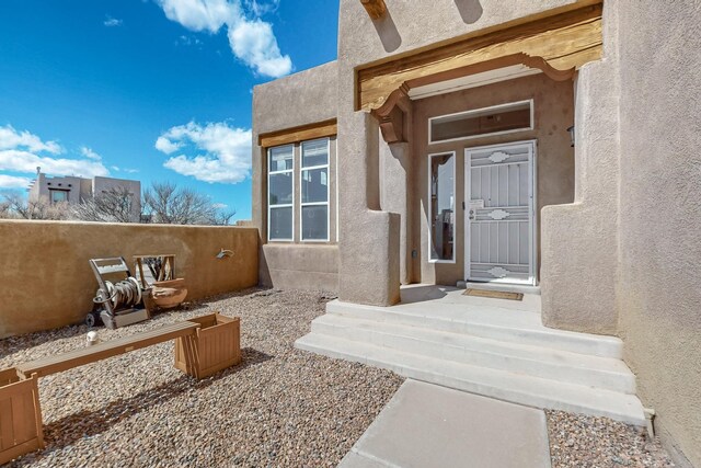 1001 Calle Garza NE, Albuquerque, NM 87113 - property entrance with stucco siding