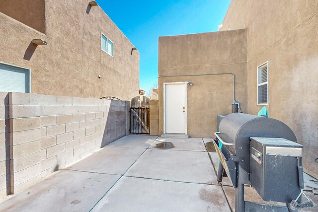 1001 Calle Garza NE, Albuquerque, NM 87113 - view of patio / terrace featuring a gate, fence, and grilling area