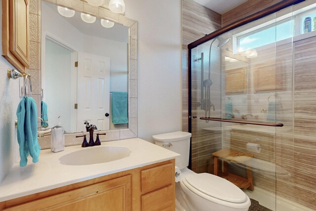 1001 Calle Garza NE, Albuquerque, NM 87113 - bathroom with vanity, a shower stall, and toilet