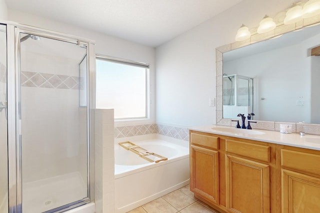 1001 Calle Garza NE, Albuquerque, NM 87113 - full bathroom featuring vanity, a bath, a shower stall, and tile patterned flooring