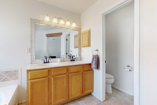 1001 Calle Garza NE, Albuquerque, NM 87113 - bathroom with double vanity, toilet, tile patterned floors, and a sink