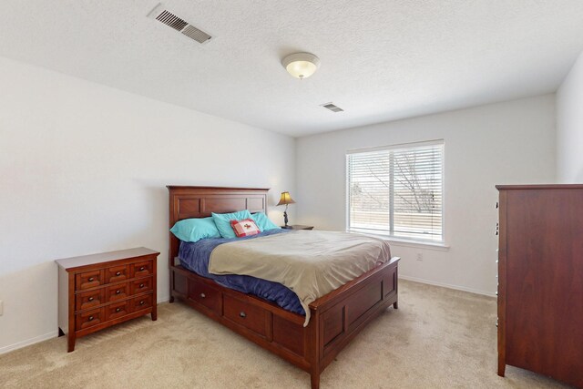 1001 Calle Garza NE, Albuquerque, NM 87113 - bedroom with visible vents, baseboards, and light colored carpet