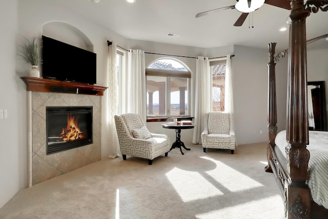 901 12th Ave SE, Rio Rancho, NM 87124 - sitting room featuring carpet flooring, a tile fireplace, and ceiling fan