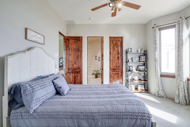 901 12th Ave SE, Rio Rancho, NM 87124 - carpeted bedroom featuring ceiling fan and connected bathroom