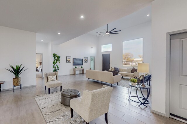 2006 Suttle Ct NE, Rio Rancho, NM 87124 - living room with baseboards, ceiling fan, light wood-style flooring, recessed lighting, and a high ceiling