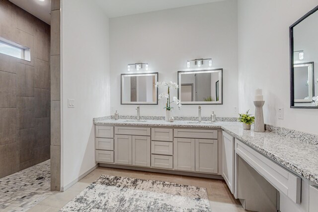 2006 Suttle Ct NE, Rio Rancho, NM 87124 - full bathroom featuring a sink, baseboards, double vanity, and a walk in shower