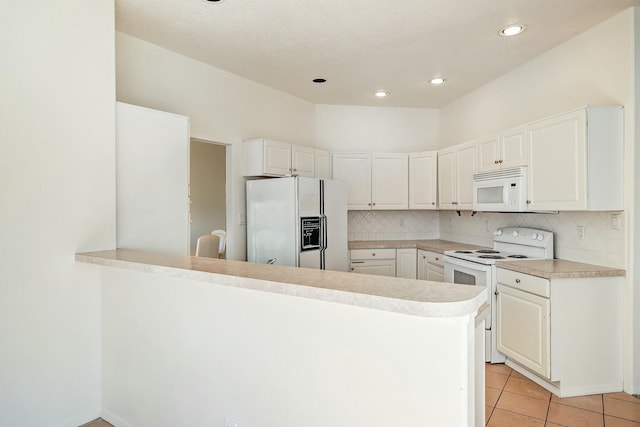 kitchen featuring white appliances, light tile patterned floors, a peninsula, and backsplash