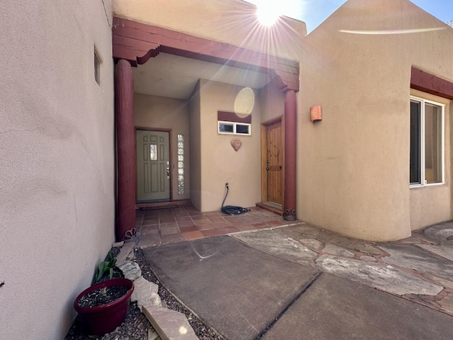 2638 Aloysia Ln NW, Albuquerque, NM 87104 - entrance to property featuring a patio area and stucco siding
