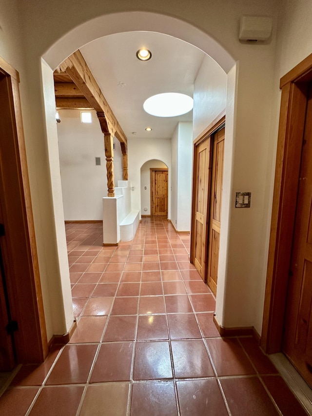 2638 Aloysia Ln NW, Albuquerque, NM 87104 - hall with recessed lighting, baseboards, arched walkways, and tile patterned flooring