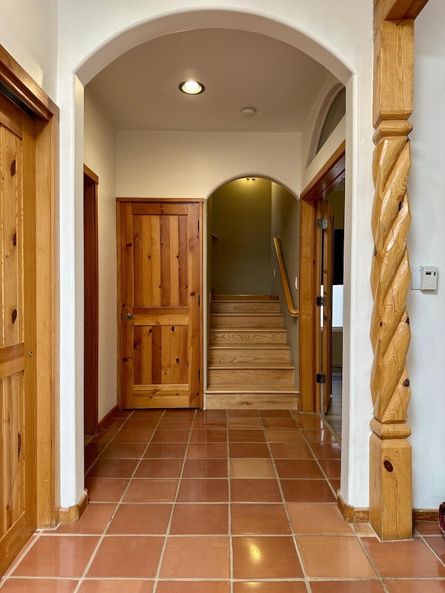 2638 Aloysia Ln NW, Albuquerque, NM 87104 - corridor with tile patterned floors, stairway, and arched walkways