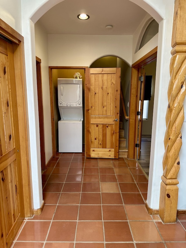 2638 Aloysia Ln NW, Albuquerque, NM 87104 - hall with stacked washer / dryer, stairs, recessed lighting, arched walkways, and tile patterned floors