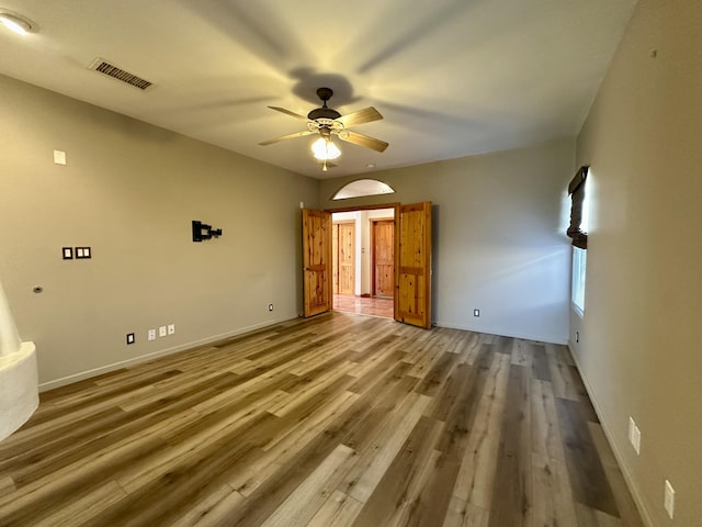 2638 Aloysia Ln NW, Albuquerque, NM 87104 - interior space featuring visible vents, a ceiling fan, baseboards, and wood finished floors