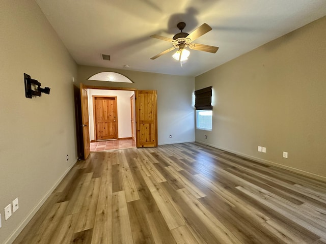 2638 Aloysia Ln NW, Albuquerque, NM 87104 - unfurnished bedroom with light wood-style flooring, baseboards, visible vents, and ceiling fan