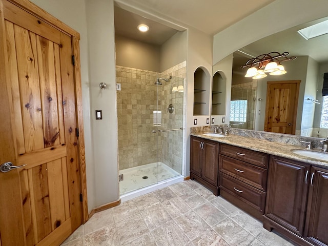 2638 Aloysia Ln NW, Albuquerque, NM 87104 - full bathroom with a sink, a stall shower, and double vanity