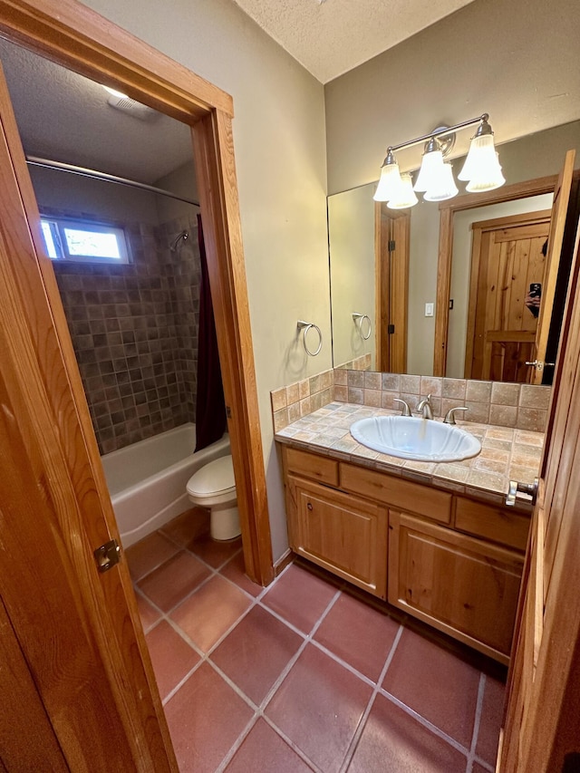 2638 Aloysia Ln NW, Albuquerque, NM 87104 - full bathroom with vanity, a textured ceiling, tile patterned floors, toilet, and shower / tub combo with curtain