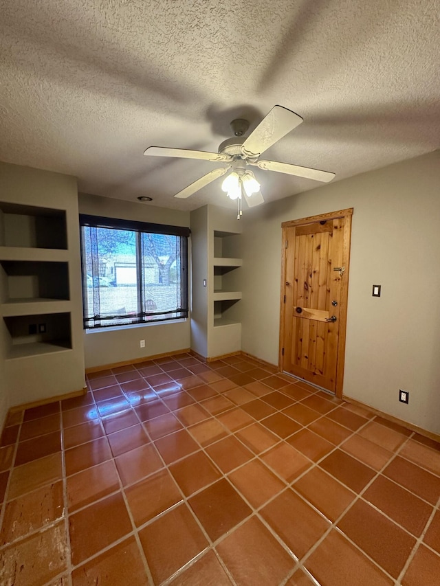 2638 Aloysia Ln NW, Albuquerque, NM 87104 - interior space with tile patterned floors, built in features, a ceiling fan, and a textured ceiling