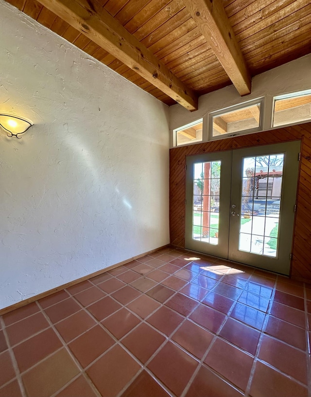 2638 Aloysia Ln NW, Albuquerque, NM 87104 - spare room with dark tile patterned floors, beam ceiling, french doors, and wood ceiling