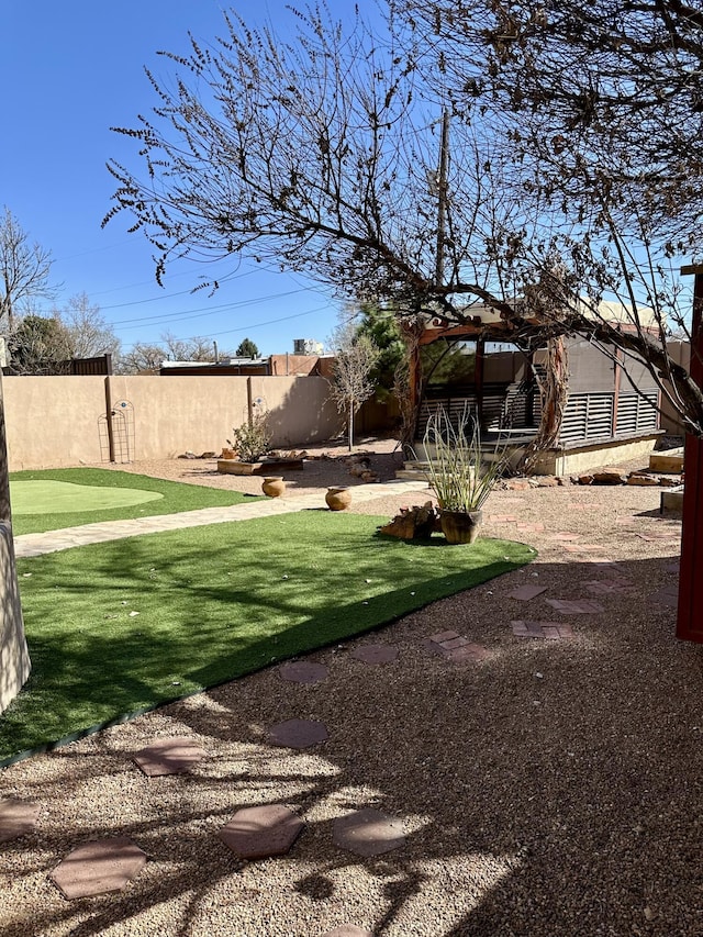 2638 Aloysia Ln NW, Albuquerque, NM 87104 - view of yard featuring a patio and a fenced backyard