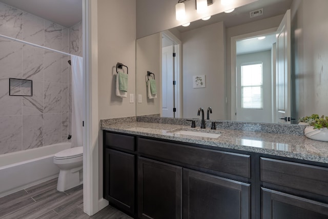 7754 Majesty Ct NW, Albuquerque, NM 87107 - full bathroom with toilet, vanity, shower / tub combo, and wood finished floors