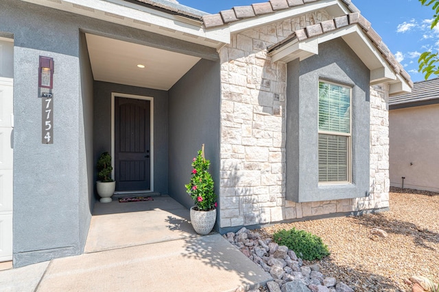 7754 Majesty Ct NW, Albuquerque, NM 87107 - view of exterior entry featuring stone siding and stucco siding