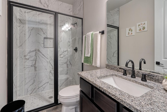7754 Majesty Ct NW, Albuquerque, NM 87107 - bathroom featuring toilet, vanity, a stall shower, and wood finished floors