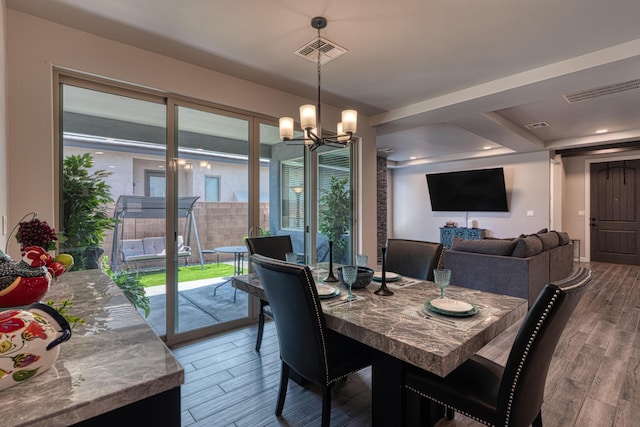7754 Majesty Ct NW, Albuquerque, NM 87107 - dining space with a chandelier and wood finished floors