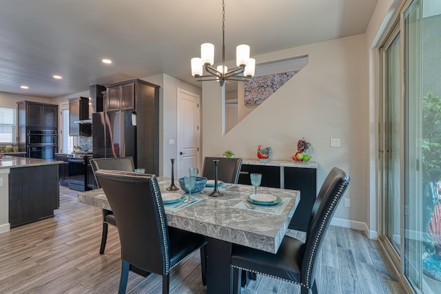 7754 Majesty Ct NW, Albuquerque, NM 87107 - dining space featuring light wood-style floors, a chandelier, recessed lighting, and baseboards