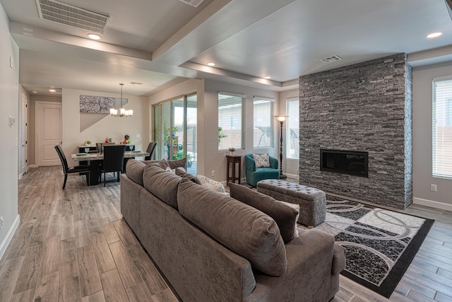 7754 Majesty Ct NW, Albuquerque, NM 87107 - living area featuring light wood-style flooring, baseboards, a chandelier, healthy amount of natural light, and recessed lighting