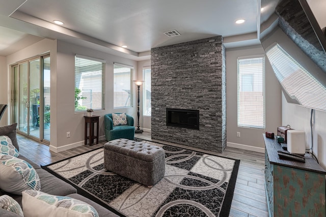 7754 Majesty Ct NW, Albuquerque, NM 87107 - living area with wood finished floors, baseboards, a fireplace, and recessed lighting