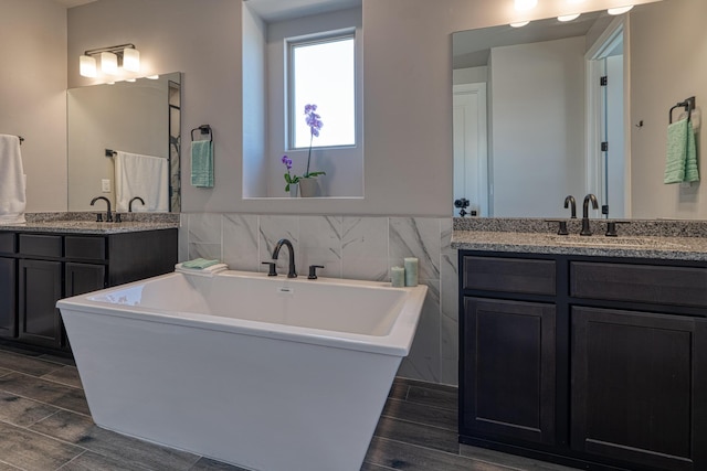 7754 Majesty Ct NW, Albuquerque, NM 87107 - full bath with wood finish floors, two vanities, and a soaking tub