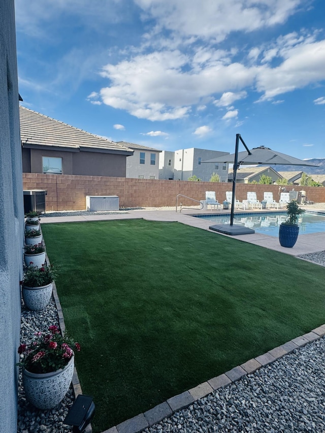 7754 Majesty Ct NW, Albuquerque, NM 87107 - view of yard with central AC unit and a patio
