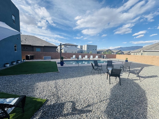 7754 Majesty Ct NW, Albuquerque, NM 87107 - fenced backyard featuring central AC, a patio, and a residential view