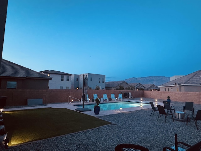 7754 Majesty Ct NW, Albuquerque, NM 87107 - view of swimming pool featuring a fenced backyard, a patio area, a mountain view, and a residential view