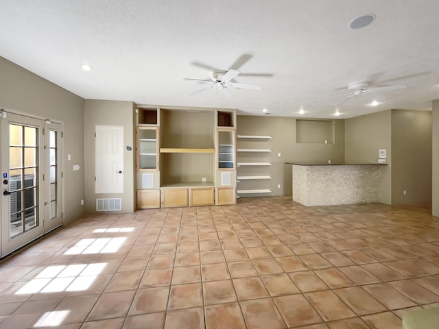 unfurnished living room with recessed lighting, visible vents, light tile patterned flooring, and a ceiling fan