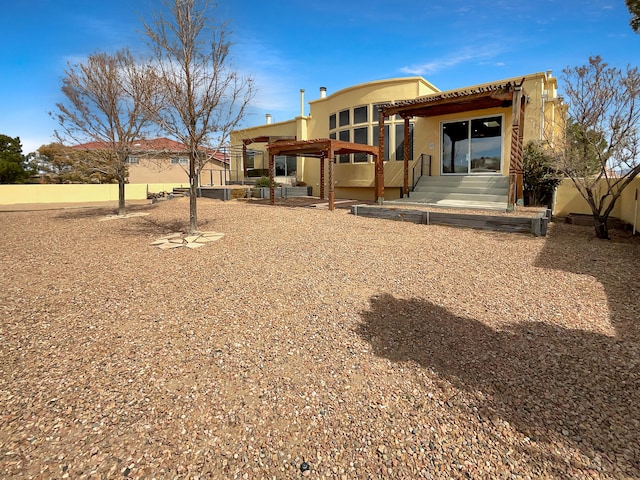 back of property featuring a patio area, stucco siding, and entry steps