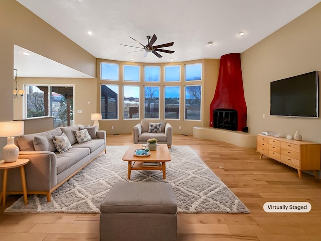 living room with recessed lighting, ceiling fan, and light wood finished floors