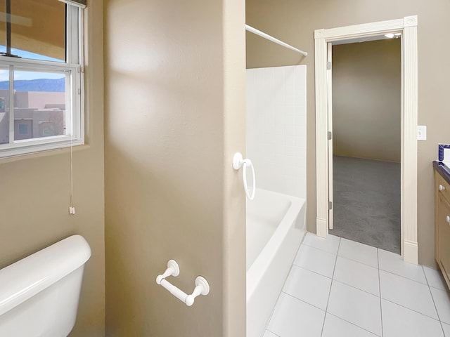 full bathroom featuring tile patterned flooring, toilet, vanity, and shower / bath combination